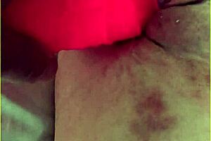 My wifey is pushing her big 10 inch dildo into her shaved pussy