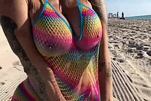 Beautiful milf relaxes on the beach