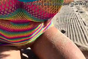 Beautiful milf relaxes on the beach