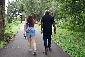 Nerdy milf strokes and sucks big black dick in the park