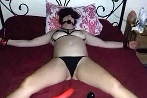 Blindfolded and bound on bed, anticipating a stranger's touch