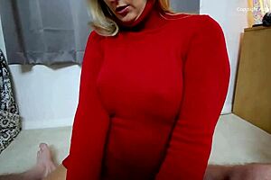 Blonde milf gives handjob in red sweater.