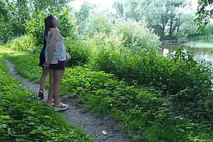 Two Girls Pee Golden Rain By The Road!