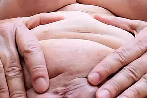 Busty Granny Seduces with Shaved Pussy!