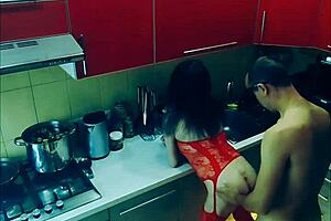 beautiful slender wife in erotic bodysuit in the kitchen