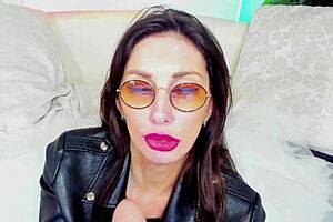 Hot MILF in glasses gives blowjob while masturbating with dildo and toys