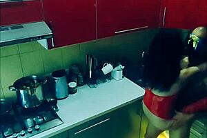 beautiful slender wife in erotic bodysuit in the kitchen