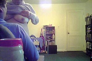 Loris shows titties in the living room setting.