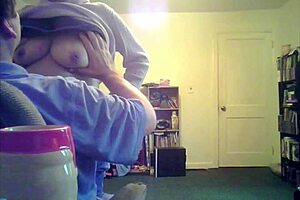 Loris shows titties in the living room setting.