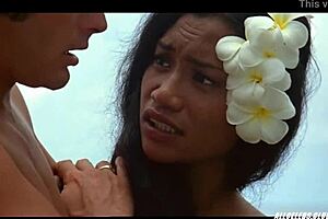 Manuia Taie appears in the 1981 film Pacific Banana, showcasing her big tits and retro charm in a topless banana scene.