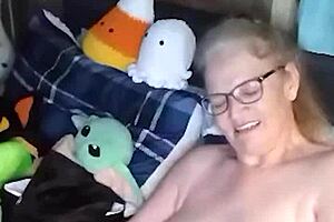 Curvy mature woman performs naked yoga in her room. She spreads legs wide and fingers her saggy tits until orgasm hits.