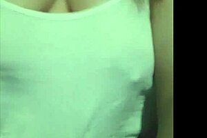 She casually strolled through the public area, showing off her big boobs while walking along.