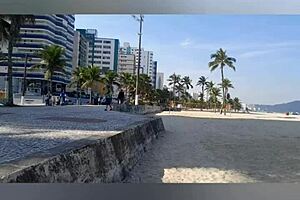 Far out! This sexy African milf flashes big natural tits and pussy lips on the beach.