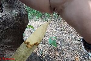 hey check it, this perverted slut is squirting piss from a wooden stake deep in the forest outdoors 😈🌳💦