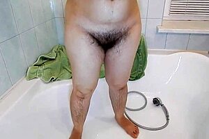 Hairy mature lady rubs her pussy until she cums hard