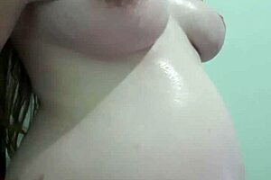 why is this pregnant milf getting cream and massage on her natural tits