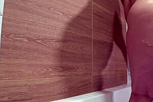 Hidden bathroom camera spies on plump mature wife showering her curvy pawg body