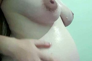why is this pregnant milf getting cream and massage on her natural tits