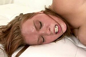 Sierra Skye is this busty blonde milf who takes an Asian cock deep in her shaved pussy on the bed.