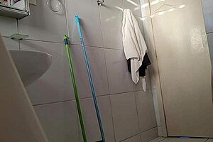 in the gym bathroom, a skinny latina with small tits and narrow ass poses solo