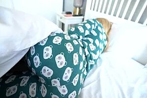 Stepmom and stepson get cozy sharing a bed in hotel room.