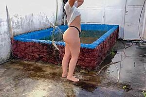 My stepmom bathes on the balcony in bikini showing off her irresistible big ass