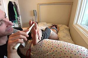 Gwen experiences a very erotic foot tickling buffet in part 1 of this full bondage video.