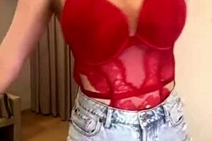 my stepmother displays her big milky tits in a red bodysuit during a homemade webcam session