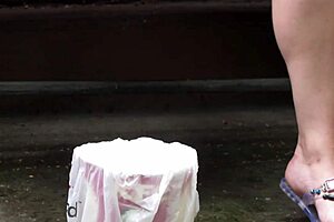 gorgeous outdoor pissing as plump milf smokes cigarette and urinates on street bench in amateur fetish