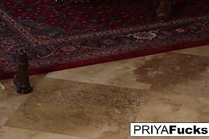 Priya Rai slobbers on giant black dildo