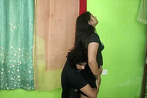 Indian couple shares sweet kisses and romantic moments with chubby wife riding big cock in bedroom.