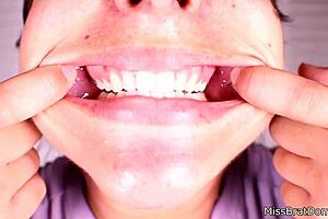 She explored her mouth fetish up close while gagged in that intense session