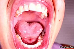 She explored her mouth fetish up close while gagged in that intense session