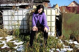 cute milf smokes a cigarette and shows her naked body with a dildo inside outdoors amateur fetish in a public place