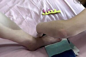 Sexy blonde milf and cute brunette virgin without panties in stockings paint toes on bed. They explore big ass, pussy, natural tits with close up handjob and fingering as lesbians and bisexuals.