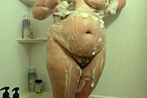 Did you see this hidden cam catching voyeur BBW milf soaking wet in shower?