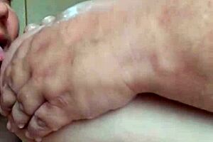 milf plays with pussy in bathtub then sucks step son's cock deep. she climbs on top for cum over her big boobs.