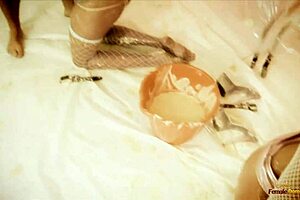 Two horny brunette babes in fishnets ride cocks in a hot 4some. They get cum on faces after intense doggystyle fucking.