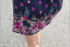 casual upskirt view of puta callejera in skirt on street