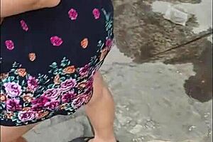 casual upskirt view of puta callejera in skirt on street