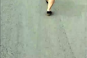 casual upskirt view of puta callejera in skirt on street