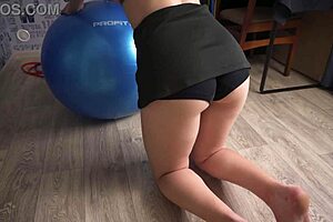 fit milf teases tight ass in sports skirt on exercise ball during workout
