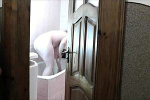 naked sexy blonde woman in bathroom without panties. Pervert man roommate watches outside masturbating cock for cumshot on old young 18+ wet pussy with natural tits.