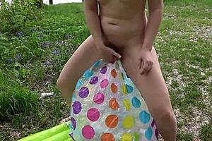 Hairy Pussy Fiercely Pissed, Spat On, And Fucked With Beach Ball Outdoors