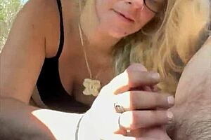 hey, check out this real hooker with glasses dropping to her knees in public, sucking off an old man for cash and taking his cum load in her mouth