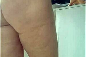 Stepmom tries on micro bikini for beach trip and asks stepson for opinion on videos.