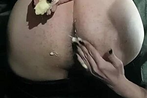 My girlfriend slides a banana deep into my ass for fetish fun.