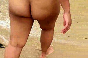 Bold asian wife flaunts big tits nude on beach