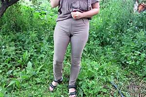 milf pisses jeans in public garden fetish