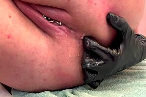 close up on shaved pussy lips pierced clit squirting wet in public toilet outdoors